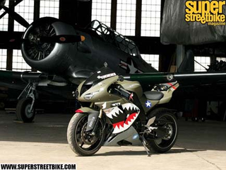 Illustration for article titled Cars, Nose Art, Shark Teeth!